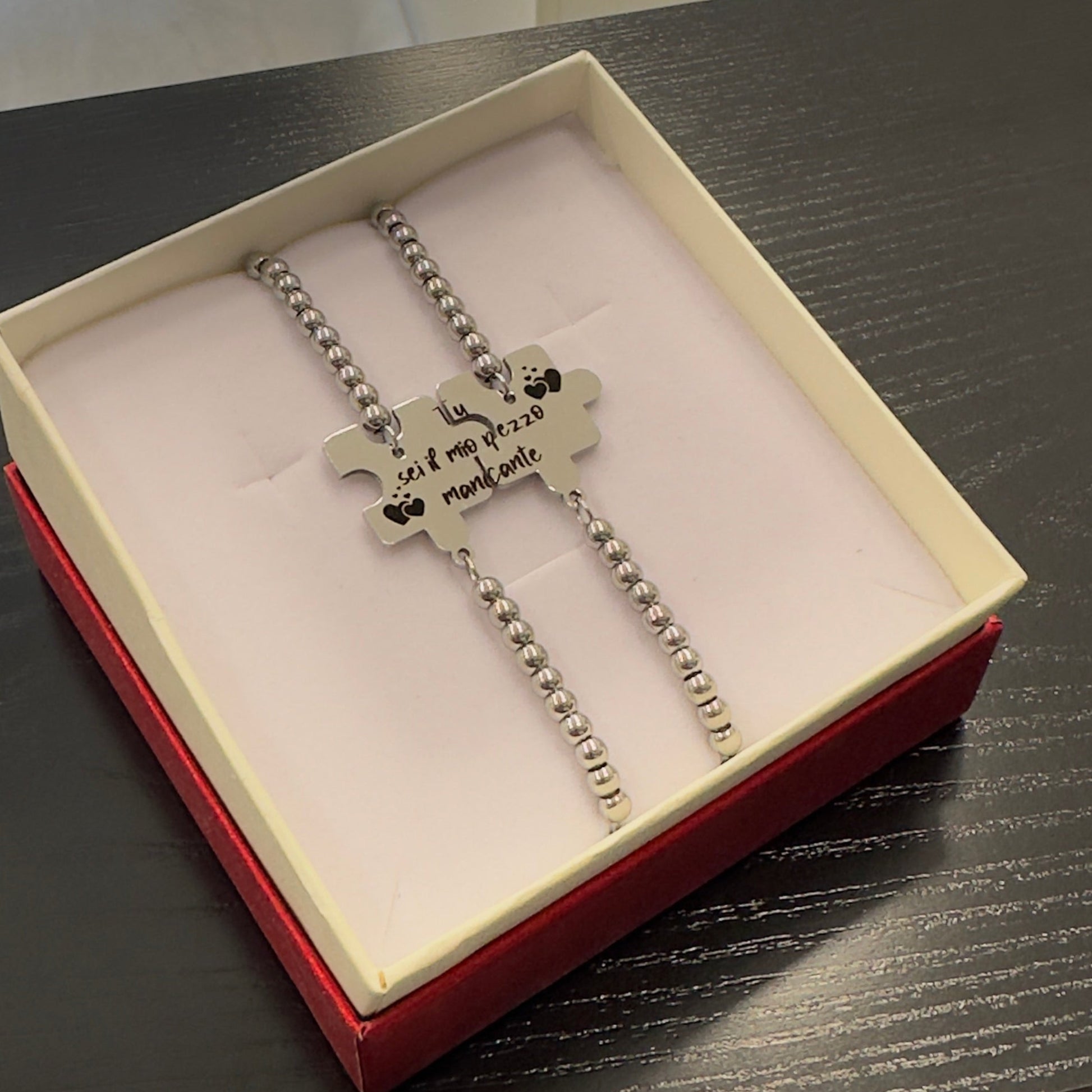 Bracciali coppia a forma di puzzle in acciaio con frase Tu sei il mio pezzo mancante
